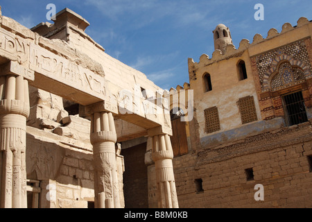 Egypt, Luxor temple building ruins, Great Court of Ramses II and Mosque of [Abu el-Haggag] against blue sky Stock Photo