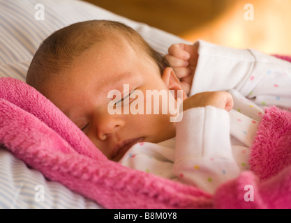 Five week old baby girl asleep Stock Photo