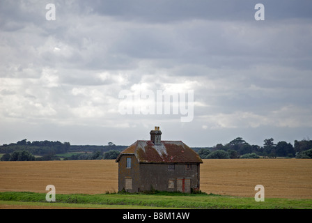 Boarded-up rural house, Felixstowe Ferry, Suffolk, UK. Stock Photo