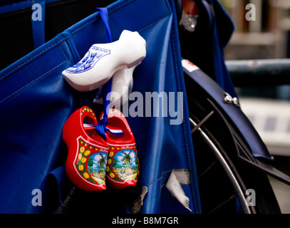 souvenir clogs hanging on back of a bicycle in Amsterdam Stock Photo