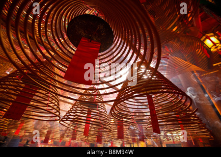 Incense coils burning in Man Mo Temple on Hollywood Road in Hong Kong 2009 Stock Photo