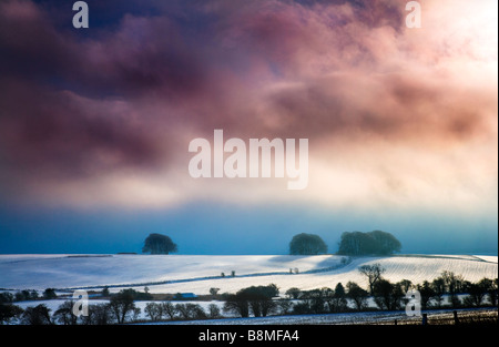 A stormy snowy winter landscape view or scene on Overton Hill near Marlborough Wiltshire England UK Stock Photo