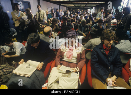 British holidaymakers delayed Gatwick Airport waiting in the departure lounge for a flight to take them on their holidays. 1980s 1981 UK HOMER SYKES Stock Photo