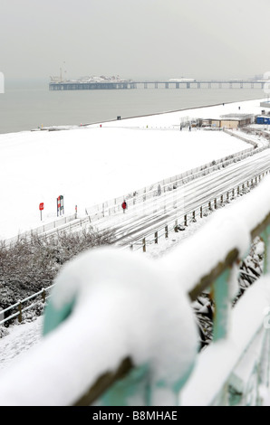 Heavy snow on Brighton beach with the pier in the background Stock Photo