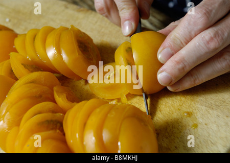 Slicing tomatoes Stock Photo
