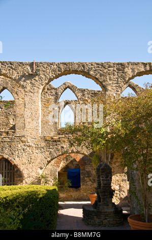 Mission San Jose arched stone walls doorways with green shrubs and spanish bayonets Missions National Park San Antonio Texas tx Stock Photo