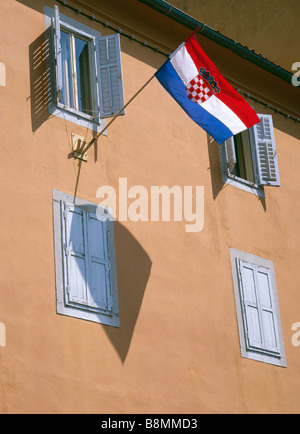Croatian flag flying on the exterior of a building. Croatia Stock Photo