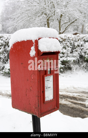 Royal Mail red post box in the snow Stock Photo