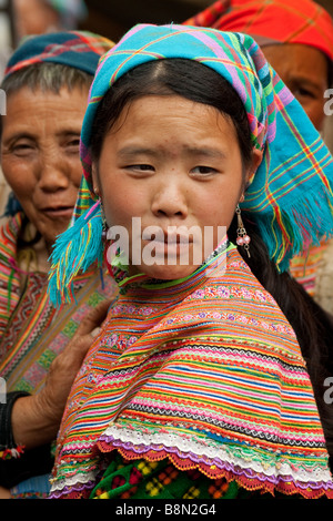 Portrait of a flower H'mong tribal girl in costume. The Bac Ha market day is a famous cultural event with ethnic minorities in a tribal gathering Stock Photo