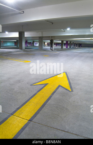 Yellow Arrow Empty Parking Garage Car Park, USA Stock Photo