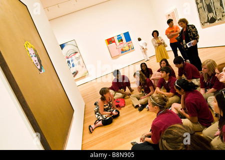 Group of secondary school girls viewing Andy Warhol's painting of Marilyn Monroe, museum of modern art Stock Photo