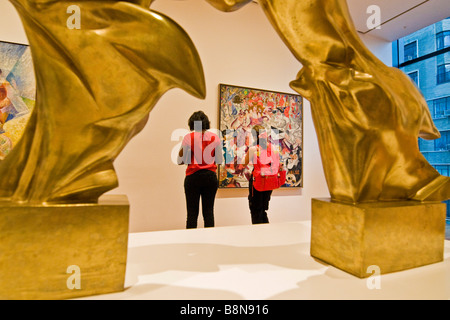 Visitors viewing various artworks, Museum of modern art Stock Photo