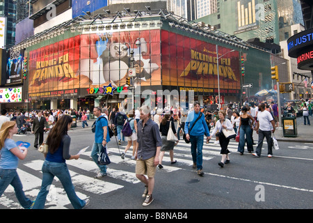 Pedestrians crossing the street on Times square Stock Photo