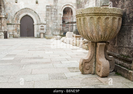 Old baptismal font in the patio Braga's Cathedral, the most ancient of all cathedrals in Portugal. Stock Photo