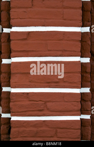 Terracota brickwall with white stripes closeup. Stock Photo