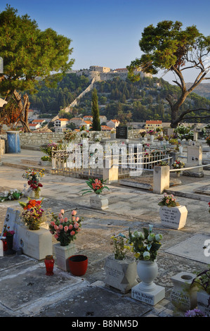 The hilltop fortress at Hvar seen from a graveyard in the town Stock Photo