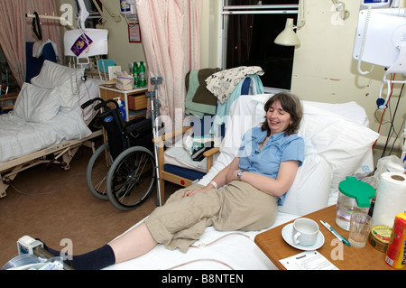 Woman Lying On NHS Hospital Bed Of Having Had An Amputation Of The ...