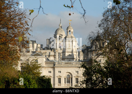 Horse Guards, headquarters of the Household Division of the cavalry, framed by trees of St James's Park, Westminster, London Stock Photo