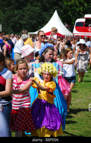 Some children enjoy the games at the Innocent Smoothie Summer Fete in Hyde Park, London Stock Photo