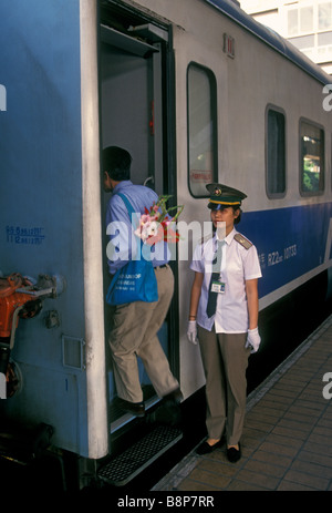 Chinese woman, train attendant, worker, employee, hostess, railway station, railroad station, train station, Shanghai, Shanghai Municipality, China Stock Photo