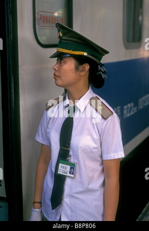 Chinese woman, train attendant, worker, employee, hostess, railway station, railroad station, train station, Shanghai, Shanghai Municipality, China Stock Photo