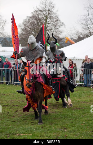 two galloping knights on horseback Stock Photo