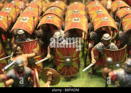 small model Roman soldiers in battle attack formation in shop window Stock Photo