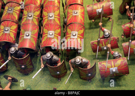 small model Roman soldiers in battle attack formation in shop window Stock Photo