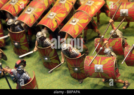 small model Roman soldiers in battle attack formation in shop window Stock Photo