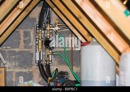 Solar heating control unit installed in loft Stock Photo