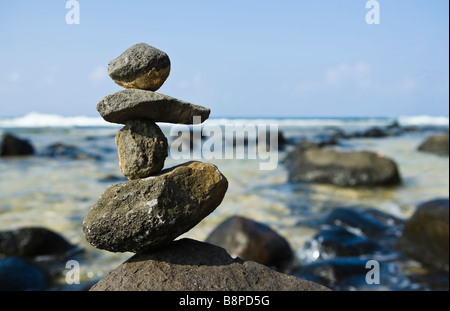 Rock stack on shore near Moloa a bay Kauai Hawaii USA Stock Photo