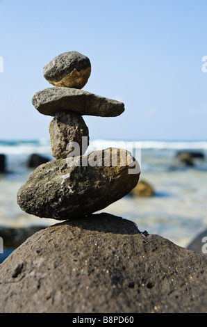 Rock stack on shore near Moloa a bay Kauai Hawaii USA Stock Photo