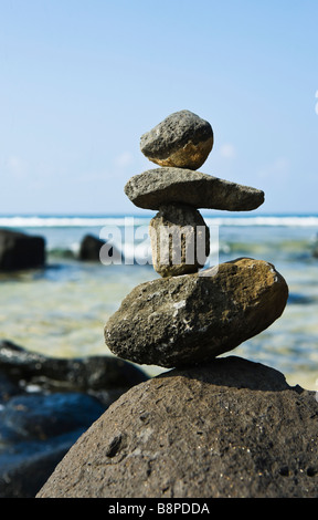 Rock stack on shore near Moloa'a bay Kauai Hawaii USA Stock Photo