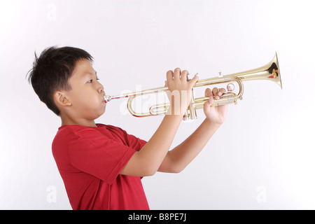 Child blow on trumpet hi-res stock photography and images - Alamy