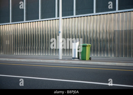 Trash cans on sidewalk Stock Photo