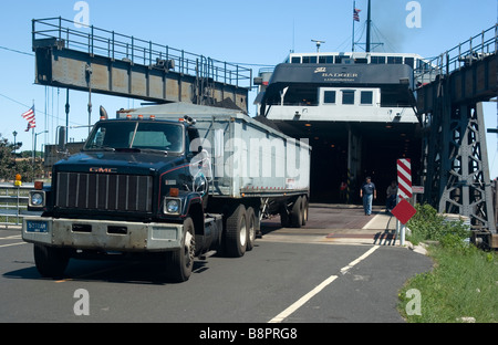 semi trailer load of coal refueling SS Badger Lake Michigan tourist passenger and vehicle ferry at Manitowoc Wisconsin Stock Photo