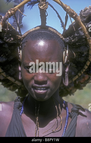 Close up portait of young Maasai moran with headdress of birds after circumcision South of Ngong Hills Kenya East Africa Stock Photo