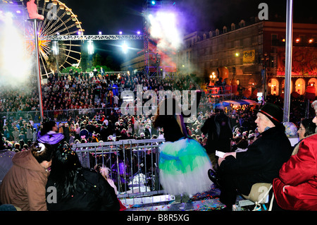 Nice France, Public Events Carnival Parade Crowd Celebrating, at Night, Streets, Woman in Dress waving at crowd Stock Photo