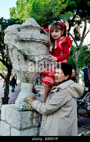 Nice, France, Public Events 'Nice Carnival' Family, Mother with Daughter in  Traditional Dress, Watching Parade in Crowd park Stock Photo