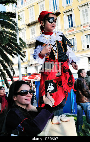 Nice, France, Public Events 'Carnival Parade' Mother with Daughter in Pirate Costume, Child Watching Parade, holidays fun, french riviera woman Stock Photo