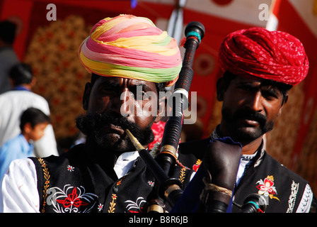 Rajasthani's playing the pipes at the Bikaner Camel Festival, Rajasthan, India Stock Photo