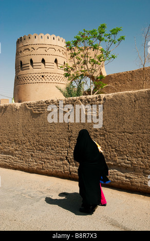 veiled woman in yazd iran old city street Stock Photo