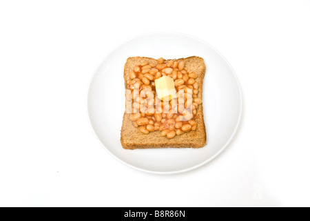 Plate of baked beans on toast isolated on a white studio background Stock Photo