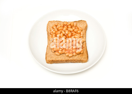 Plate of baked beans on toast isolated on a white studio background Stock Photo