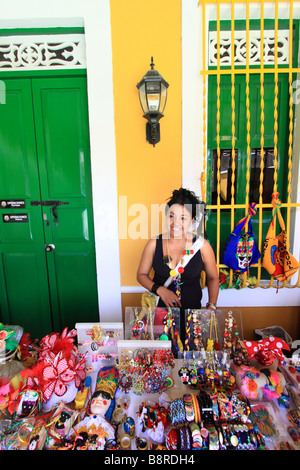 Young woman selling Carnival' souvenirs during the Carnival of Barranquilla, Atlantico,  Colombia, South America Stock Photo