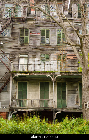 Big old decrepit house with shuttered windows Stock Photo