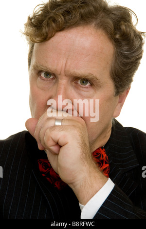man with hand in front of mouth Stock Photo