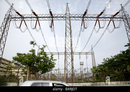 Electrical power lines and pylons in India. Hazira, Surat, Gujarat. India. Stock Photo
