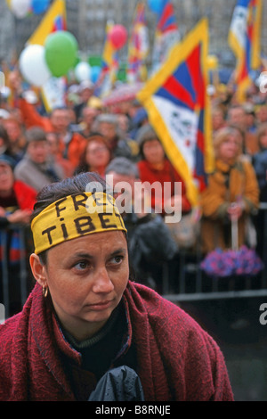 female demonstrator with headband 'Free Tibet' at a demonstration, France, Paris Stock Photo