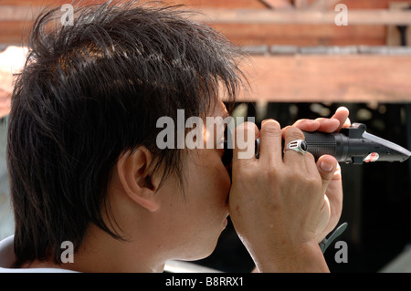 Measuring sea water salinity Sabah Parks lagoon Bohey Dulang Island Tun Sakaran Marine Park Semporna Sulu Sea Malaysia South Stock Photo